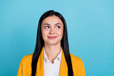 Photo of dreamy nice positive young business lady imagine plan idea cool solution isolated on blue...