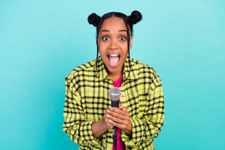 Photo of crazy trend top-knot hairdo hooray famous lady sing wear yellow shirt isolated on teal color backgroundの写真素材