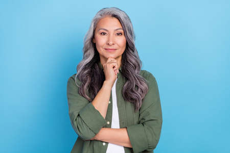 Photo of nice old grey hairdo lady hand face wear khaki shirt isolated on blue color background