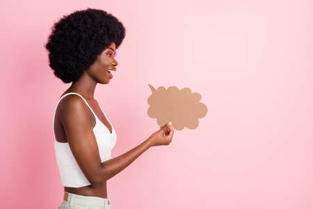 Profile photo of talking young wavy hairdo lady hold bubble wear white top isolated on pastel pink color backgroundの写真素材