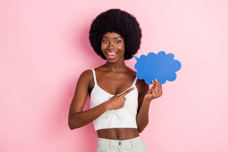 Photo of promoter lady hold speech cloud direct finger empty space wear cropped top isolated pink...