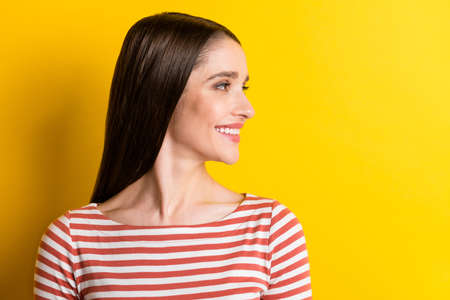 Profile photo of nice millennial lady look empty space wear red sweater isolated on vibrant yellow...