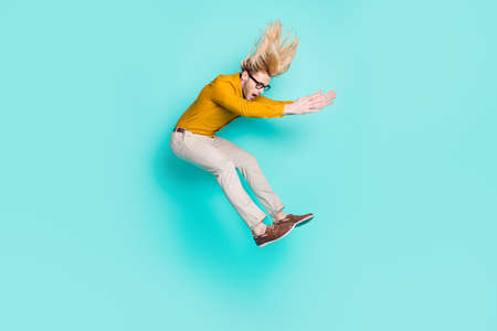 Full length profile side photo of young man jump up amazed shocked surprised look empty space...