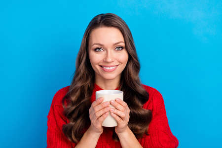 Photo portrait of pretty girl drinking coffee smiling isolated on bright blue color background