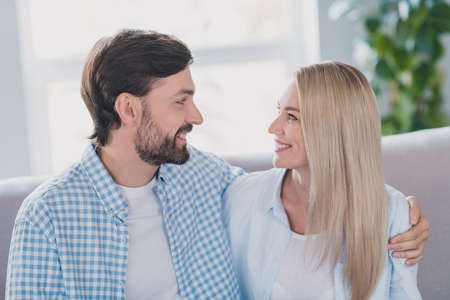 Photo of flirty mature couple hug look brunet guy blond lady wear white shirt in living room rest
