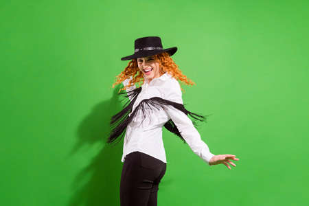 Profile photo of funky red hairdo millennial lady dance look wear shirt trousers hat isolated on...