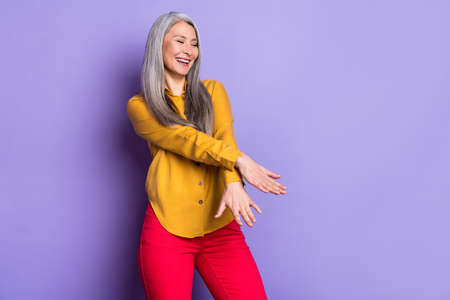 Portrait of attractive cheerful woman dancing moving having fun good mood isolated over bright...