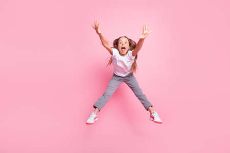 Full size photo of nice impressed blond girl jump wear white t-shirt isolated on pastel pink color...