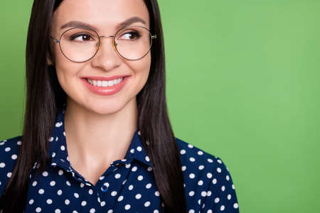 Cropped photo of sweet brunette hairdo smart lady look empty space wear spectacles blue shirt...