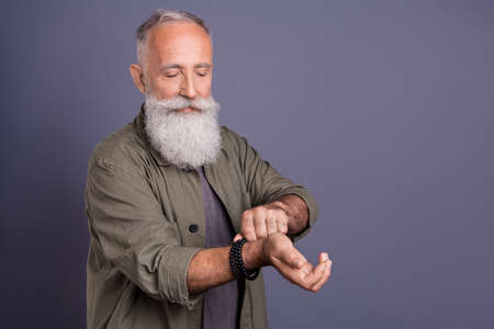 Photo of handsome mature man look put hand accessories casual outfit isolated over grey color...