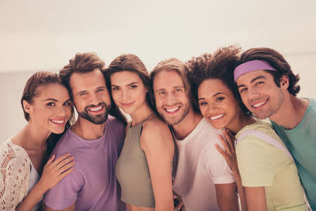 Photo of cute charming young diversity group wear casual clothes hugging smiling outside countryside