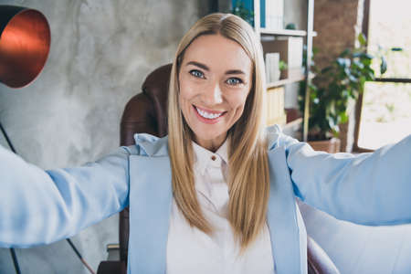 Portrait of smart successful chief lady make selfie partners online meeting video-call in modern coworking workplaceの写真素材