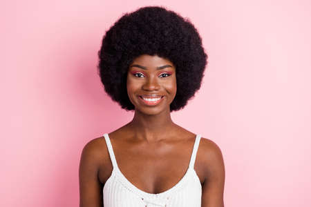 Photo of optimistic millennial brunette hairdo lady wear white top isolated on pastel pink color backgroundの写真素材
