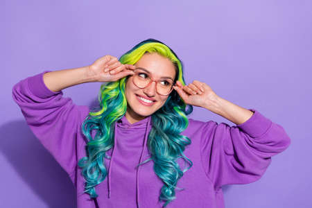 Photo of youngster with shine vivid haircut touch specs look empty space isolated over violet color...