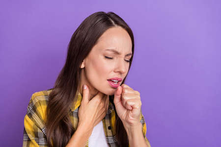 Photo of sick young brunette lady coughing wear checkered shirt isolated on purple color background