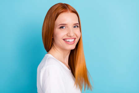 Profile photo of gorgeous satisfied girl toothy smile look camera isolated on pastel blue color...