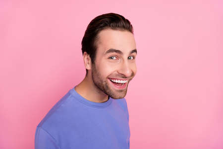 Photo of beard nice young guy look camera wear blue pullover isolated on pastel pink color backgroundの写真素材
