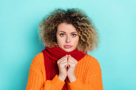 Photo of girlish adorable sick lady freezing wear scarf knitted sweater isolated turquoise color backgroundの写真素材