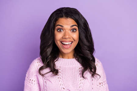 Photo of pretty impressed dark skin woman wear pink sweater big eyes open mouth isolated violet color backgroundの写真素材
