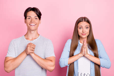 Photo of impressed thankful young couple wear casual clothes smiling arms together isolated pink color backgroundの写真素材