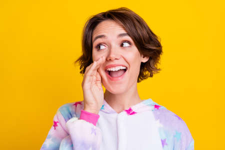 Photo of young cheerful girl happy positive smile hand near mouth advertise yell isolated over...
