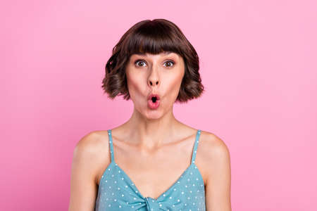 Portrait of attractive worried amazed girl sudden news reaction isolated over pink pastel color backgroundの写真素材