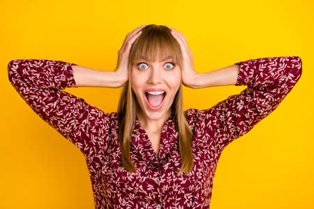 Photo portrait of blonde woman amazed keeping head staring opened mouth isolated vivid yellow color backgroundの写真素材