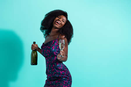 Photo of nice optimistic brunette lady drink look empty space wear dark dress isolated on teal color backgroundの写真素材