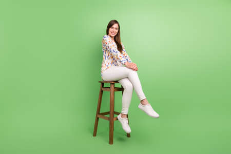 Full length profile photo of nice brunette hairdo young lady sit wear blouse trousers sneakers...