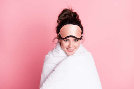 Photo of young girl happy positive smile cover blanket duvet sleep time comfort warm isolated over pink color backgroundの写真素材
