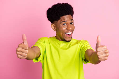 Photo of young black guy happy positive smile show thumbs-up fine perfect advert advice isolated...