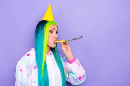 Profile photo of blow funny whistle entertain festival wear cone cap kigurumi costume isolated purple color backgroundの写真素材