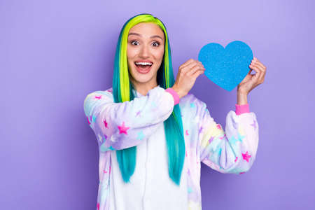 Photo of excited funky affectionate lady date app advertisement wear kigurumi costume isolated violet color backgroundの写真素材