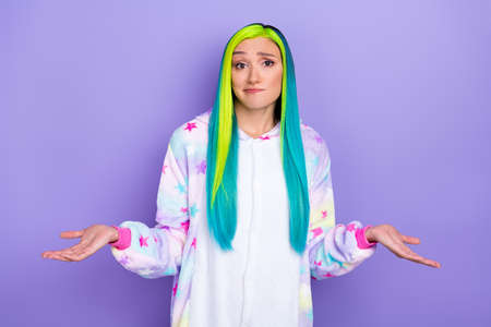 Photo of uncertain puzzled confused lady shrug shoulders wear kigurumi costume isolated violet color backgroundの写真素材