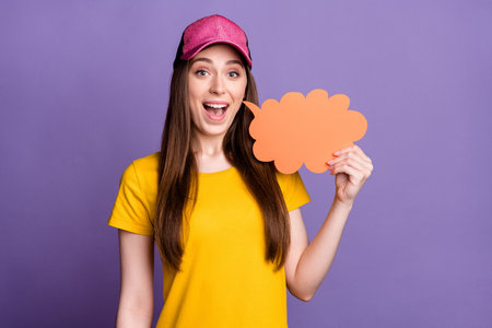 Photo of young happy cheerful happy woman hold hand cloud speech bubble talk isolated on violet...