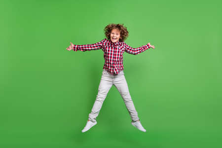Full length body size view of attractive cheerful guy jumping rest good mood isolated over bright...