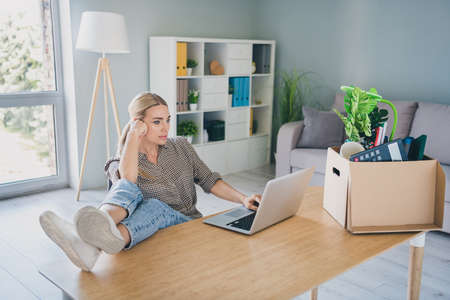 Photo of nervous specialist marketer lady sit desk use netbook wait hr recruiter answer in modern...