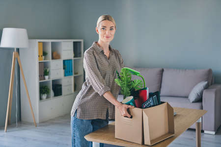Photo of marketer agent executive lady fired hold carton box office belongings move modern workspace