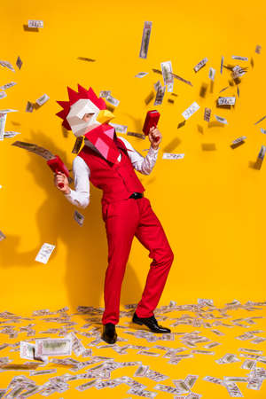 Vertical photo of anonymous guy usd shower concept wear cock mask red suit isolated yellow color...