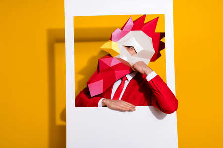 Photo of minded pensive guy in snapshot picture look empty space wear cock mask red tux isolated yellow color backgroundの写真素材