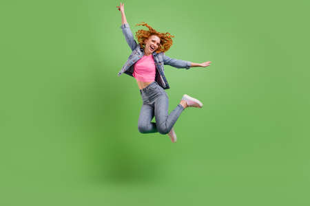 Full length photo of sweet charming young woman wear jeans outfit spectacles jumping high smiling...