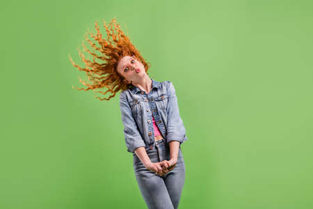 Photo flirty charming young lady dressed denim clothes glasses sending you kiss isolated green color backgroundの写真素材