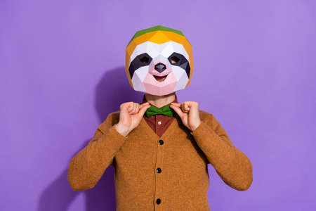 Photo of young guy wear modern outfit arrogant adjust incognito isolated over purple color backgroundの写真素材