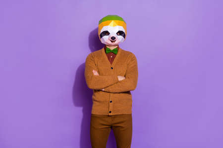 Photo of young man confident crossed hands wear modern clothes red panda isolated over violet color backgroundの写真素材