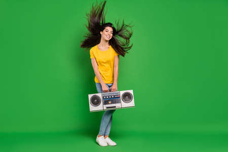 Full length body size photo dreamy girl with long brunette hair keeping retro tape recorder isolated...