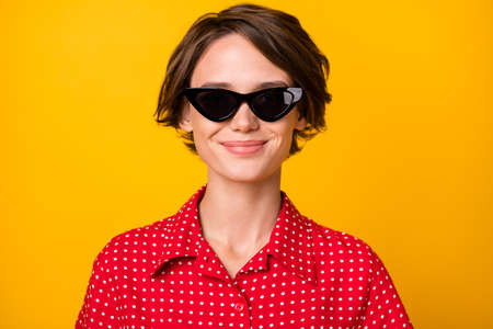 Photo of young attractive beautiful lovely smiling positive good mood girl in sunglasses isolated on...