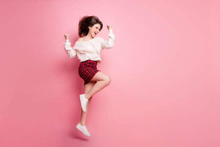 Full body profile side photo of young excited girl happy smile jump celebrate victory fists hands...