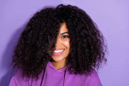 Portrait of adorable satisfied person hair cover one eye beaming smile look camera isolated on...