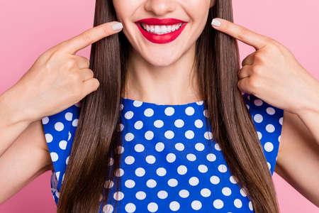 Cropped photo of young cheerful woman happy positive smile point fingers teeth ceramic white...