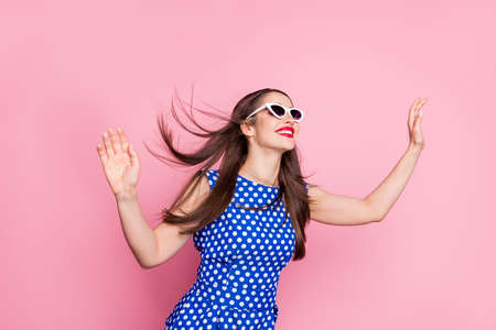 Photo of young attractive woman happy positive smile look empty space fly air hair isolated over...